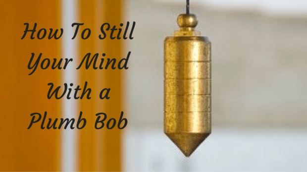 "A metal plumb bob hanging steadily from a string, representing a centered and still mind amidst life's storms."