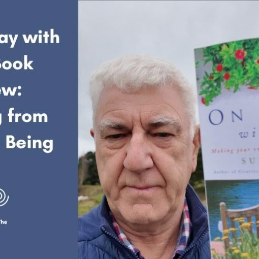 A horizontal blog header image for "Turning The Page" featuring text on the left reading, "On Holiday with God Book Review: Shifting from Doing to Being" with a spiral logo on a blue background. On the right, an older man with short white hair holds up a book titled "On Holiday with God" by Sue Pickering.