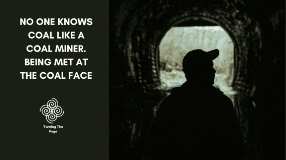 Silhouette of a man in a cap standing in a dark tunnel, facing a bright opening, beside the text “No one knows coal like a coal miner. Being met at the coal face” and the Turning The Page logo.